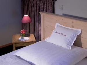 Ein Bett oder Betten in einem Zimmer der Unterkunft Rostalm