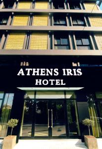 a hotel sign on the front of a building at Athens Iris Hotel in Athens