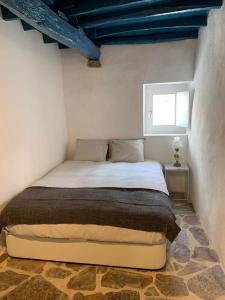 Tempat tidur dalam kamar di Casa do Castelo