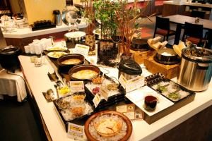 a buffet with many different types of food on a table at Hotel Kanronomori in Niseko