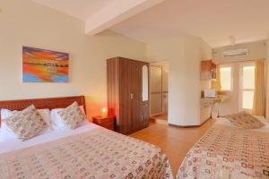 Кровать или кровати в номере L'Oiseau de L'Ocean Tourist Residence