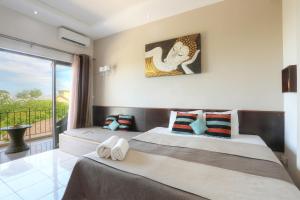 Кровать или кровати в номере L'Oiseau de L'Ocean Tourist Residence