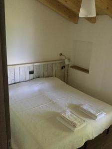 Posteľ alebo postele v izbe v ubytovaní Rifugio Dalco