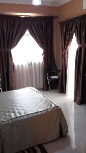 Vuode tai vuoteita majoituspaikassa Hotel AMOUDOU فندق أمودو