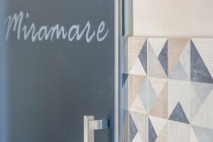 a sign on a door that says mamanca on it at Miramare love nest 5terreparco in Riomaggiore