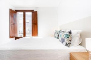 Кровать или кровати в номере Apartamento 1º de Maio