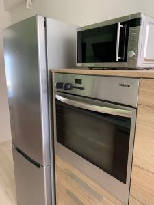 A kitchen or kitchenette at Blue Elegance City Center Heraklion Apartment