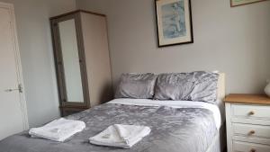 Postel nebo postele na pokoji v ubytování Oakley Hotel