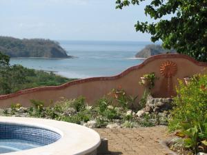 a swimming pool with a view of the ocean at Beautifull Casa Pastor in Sámara