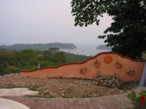 a retaining wall with plants on top of it at Beautifull Casa Pastor in Sámara