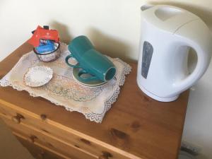 a table with a hair dryer and a blender on it at Bridge End in Northallerton