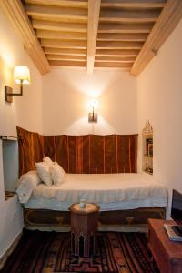 a bedroom with a large bed in a room at Dar Ben Gacem in Tunis