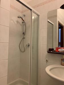 a bathroom with a shower and a sink at Balcone sul canale in Venice