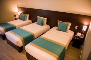 Cama ou camas em um quarto em Hotel Diamond Lima