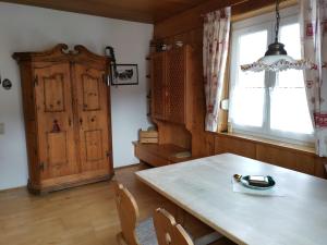 a dining room with a table and a window at Haus Pierzinger in Wörgl