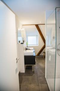 a bathroom with a sink and a mirror at Green Spirit Hotel in Regensburg +63 photos
