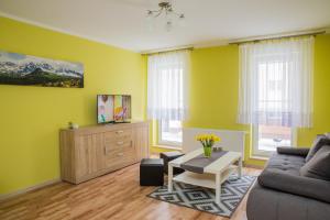 Televízia a/alebo spoločenská miestnosť v ubytovaní Family Homes - Apartamenty Sonoma