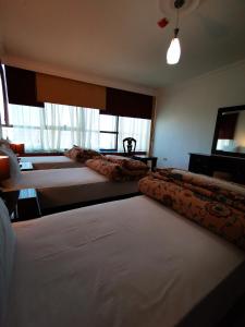 Postelja oz. postelje v sobi nastanitve Al Fakher Hotel Apartments & Suites