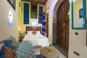 Postel nebo postele na pokoji v ubytování Riad Dar Mansoura