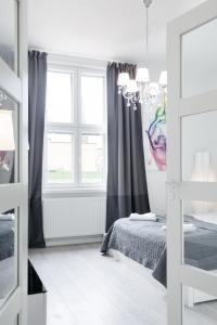 a bedroom with a bed and a window at New Modern Top Floor Residence in Helsinki