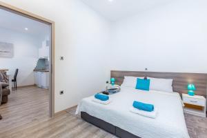Posteľ alebo postele v izbe v ubytovaní Julia apartments