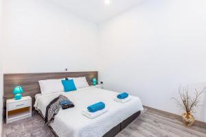 Posteľ alebo postele v izbe v ubytovaní Julia apartments