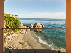 a view of the ocean from a balcony at Hotel Balcón de Europa in Nerja