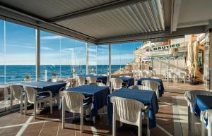 a restaurant on a cruise ship with tables and chairs at Hotel Balcón de Europa in Nerja