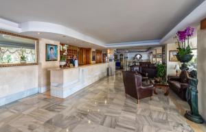 a lobby of a hotel with a bar at Hotel Balcón de Europa in Nerja
