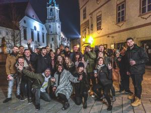 a large group of people standing in front of a building at Wild Elephants Hostel in Bratislava