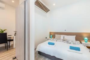 Posteľ alebo postele v izbe v ubytovaní Julia apartments
