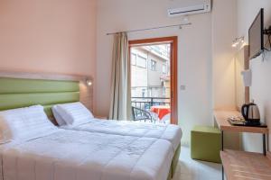 Posteľ alebo postele v izbe v ubytovaní Hotel Aggelos Kefalonia