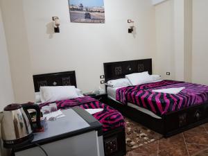 Rúm í herbergi á Qasr El salam