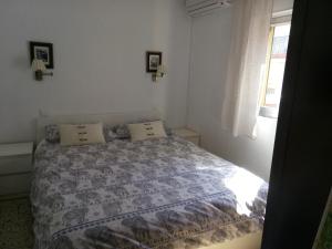 Ένα ή περισσότερα κρεβάτια σε δωμάτιο στο Apartamento Asturias