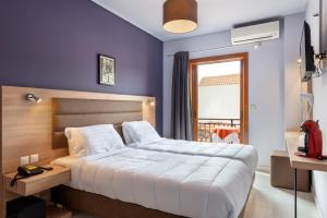 Posteľ alebo postele v izbe v ubytovaní Hotel Aggelos Kefalonia
