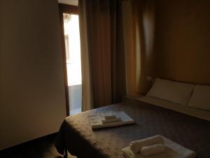 Giường trong phòng chung tại Giò Rooms
