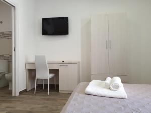 Giường trong phòng chung tại Giò Rooms
