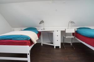 Postel nebo postele na pokoji v ubytování Ackaert Ferienwohnung Top of Thun