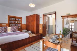 A bed or beds in a room at Thea Villas and Suite