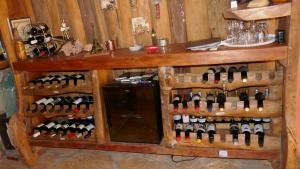a room with a bunch of bottles of wine at Pousada Cachoeiras de Milho Verde in Milho Verde