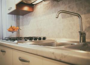 a kitchen with a sink and a stove at Villalba in Balestrate +54 photos