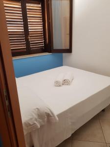 Postel nebo postele na pokoji v ubytování Villa a San Vito lo Capo Minaudo