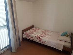 Postel nebo postele na pokoji v ubytování Apartments & Rooms Tony