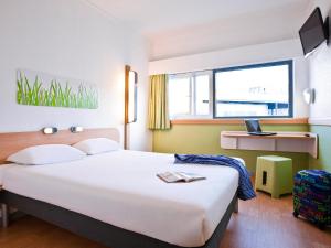Postel nebo postele na pokoji v ubytování ibis budget Parauapebas + 65 fotografií