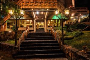 a set of stairs leading to a building at night at Hotel de la Cañada in Córdoba