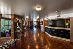 a lobby of a building with a man statue in it at Hotel de la Cañada in Córdoba