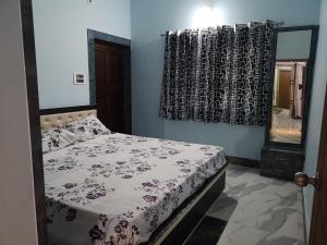Postel nebo postele na pokoji v ubytování Chairosana Mansion