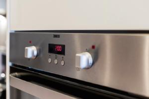 a close up of an oven with a clock on it at The Percy's Luxury in Oxford