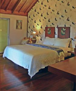 Łóżko lub łóżka w pokoju w obiekcie Tegal Panggung Guest House