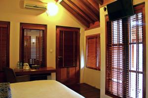 Gulta vai gultas numurā naktsmītnē Tegal Panggung Guest House